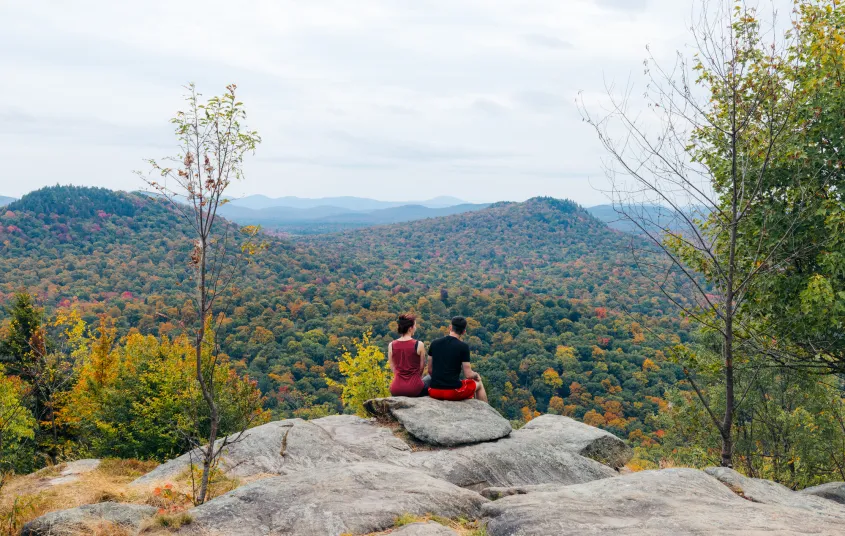 Two hikers at a scenic overlook
