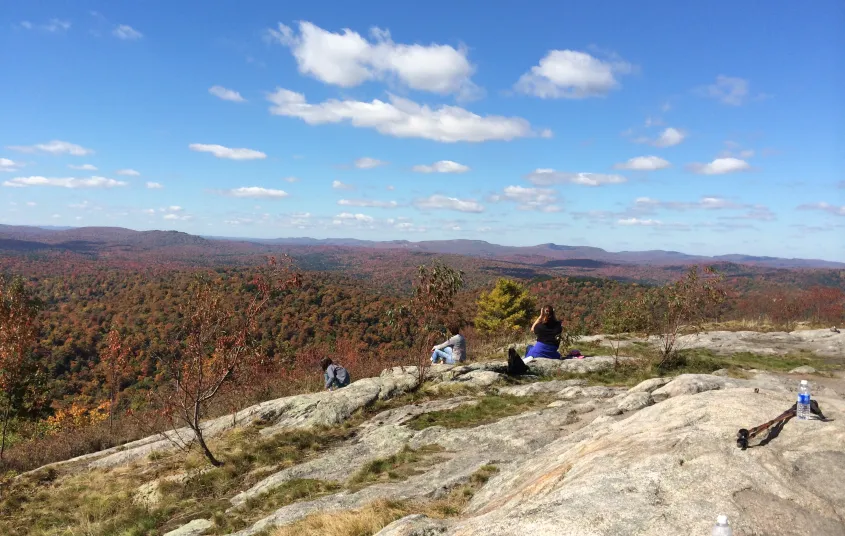 Look for the distinctive DEC signs to find parking and trailheads.