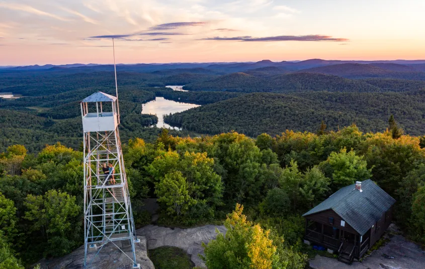 A view of an old firetower observers cabin in the winter