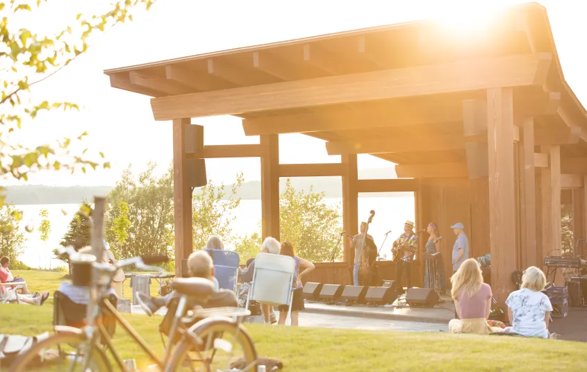 A wooden bandshell with live music happening