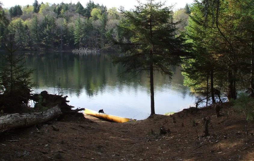 The tranquil waters of Little Tupper Lake beckon the paddler