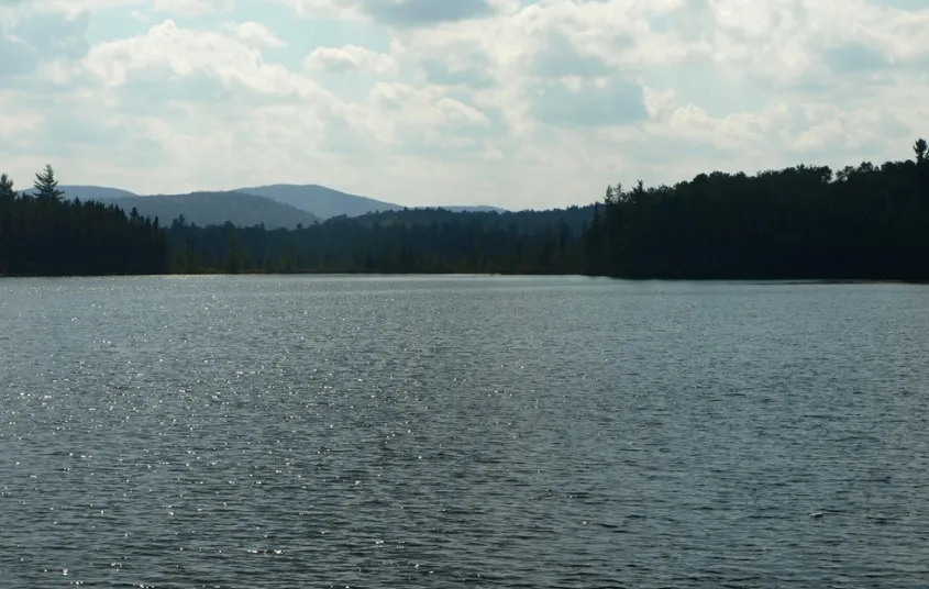 A medium-sized pond with mountain views