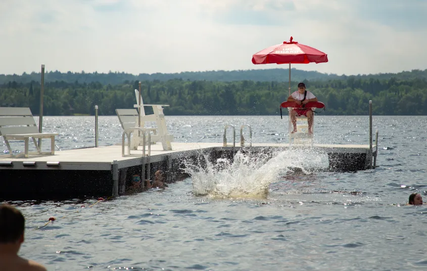Young kids race into the water