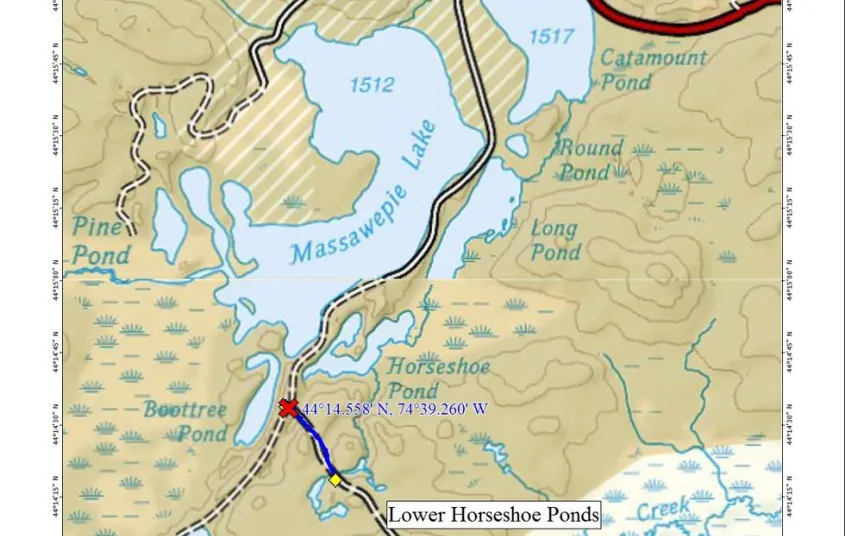 A map with bodies of water and a road cutting through.