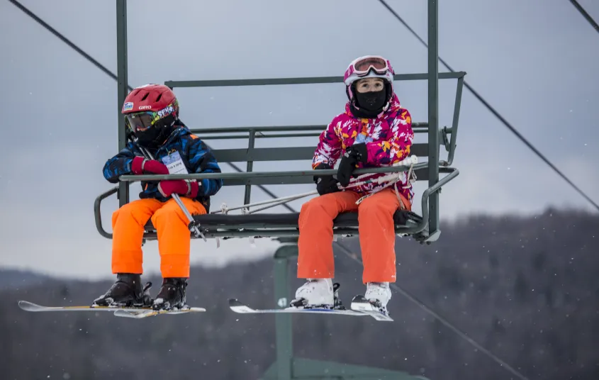 Two kids on a chair lift at Titus