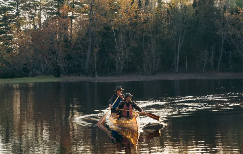 Two people in a pack canoe