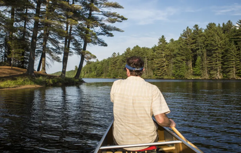 A person paddling a canoe