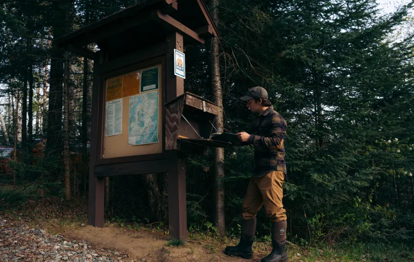 A paddler signing into a register