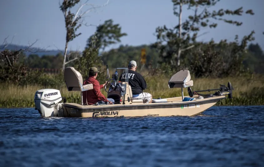 People on a motorboat in Simon Pond