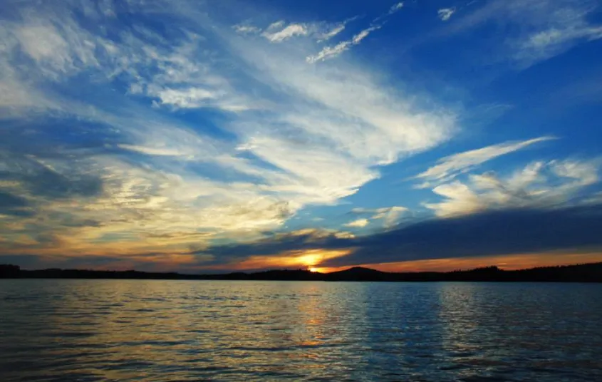 A sunset over a large lake
