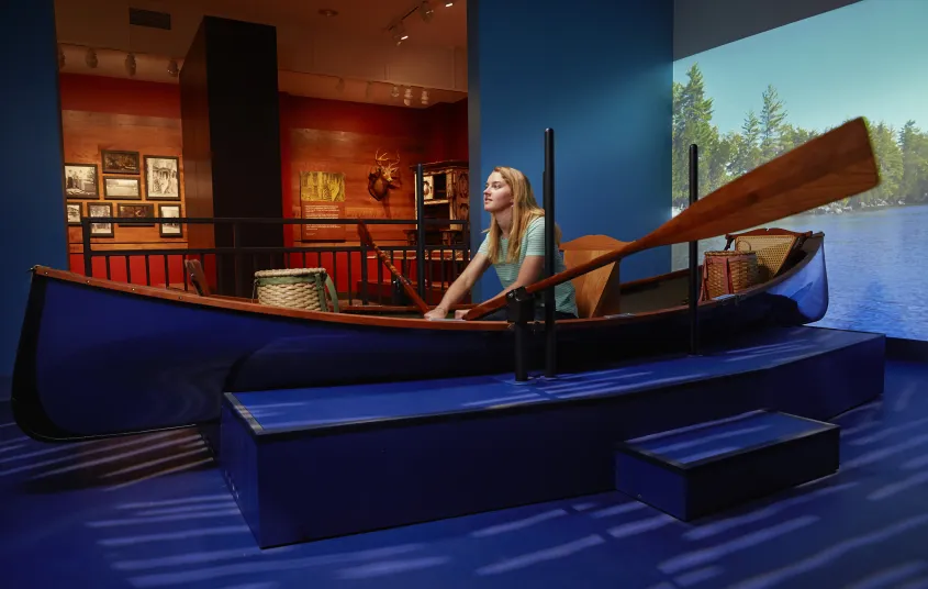  A woman rows a display boat