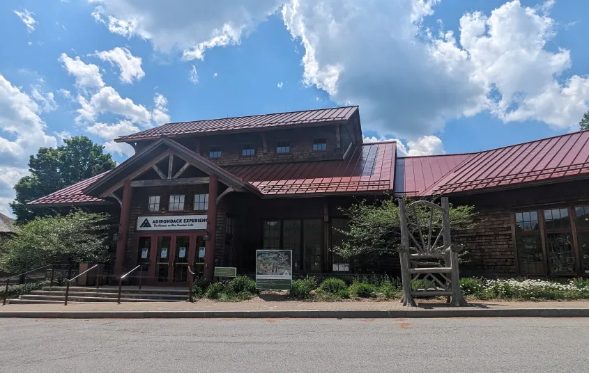  a blue carpet with a winding pathway design and blue light fixture that resembles waves