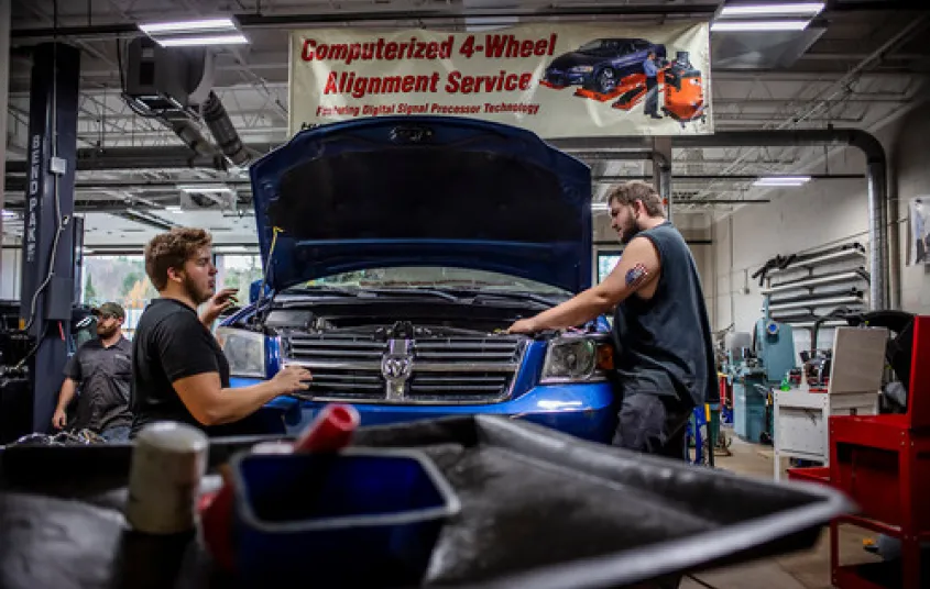 Students work on cars