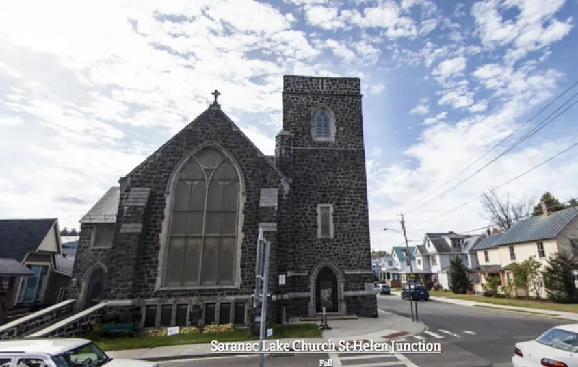 Exterior of the tall grey stone church