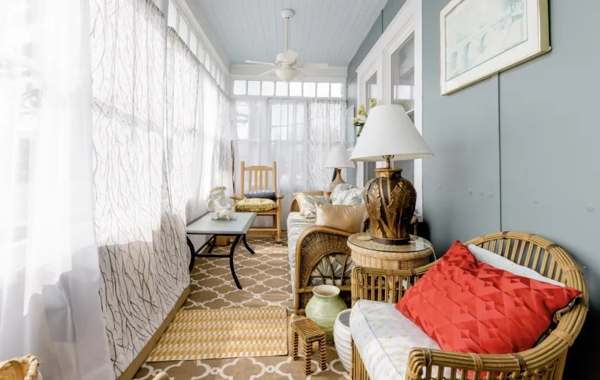 The front walkway up to a landing and the three season room.