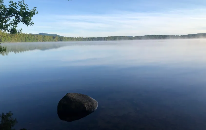 The smooth as glass waters of Lake Clear