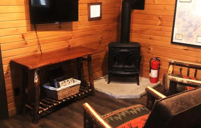 The living space with two rustic arm chairs