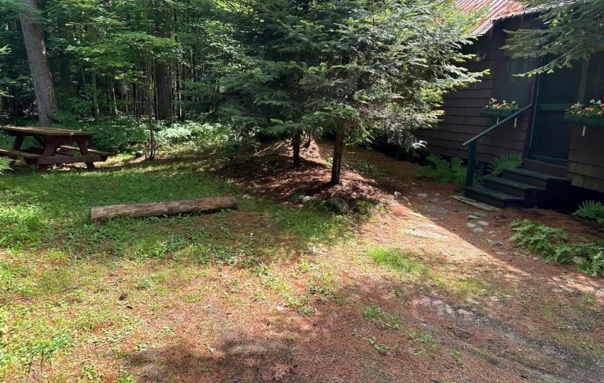 Rustic bedding in the cozy sleeping space at Rockledge Cabins & Retreats 