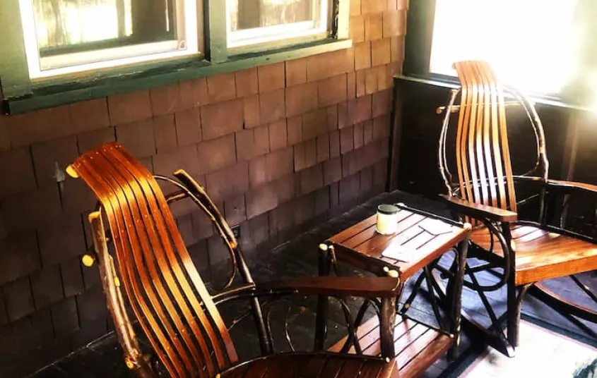 A bedroom with knotty pine paneling