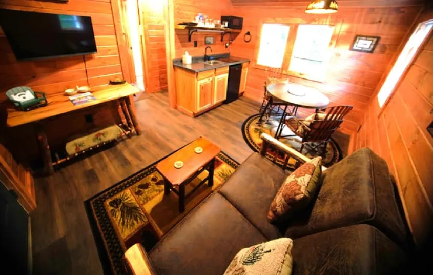  wood stove and tv at Rockledge Cabins & Retreats 