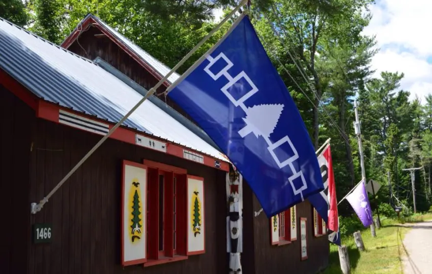 A blue flag hangs outside.