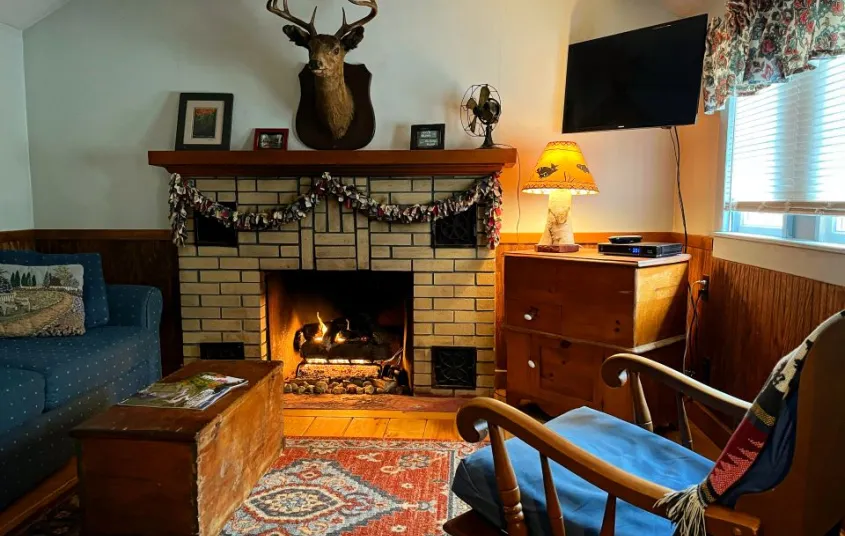 Cozy living space with fireplace and ample seating.