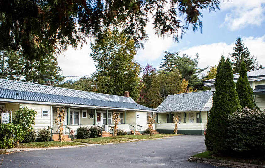 The exterior of two building and the parking lot of The Ashley.