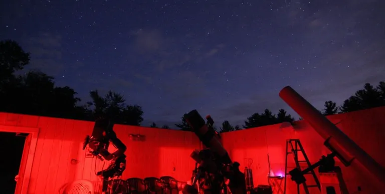 Astronomy equipment glowing with red light