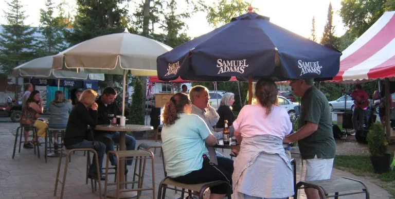 Tables outside with large umbrellas