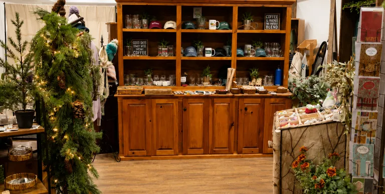 Decor on display in a large hutch with shelves.