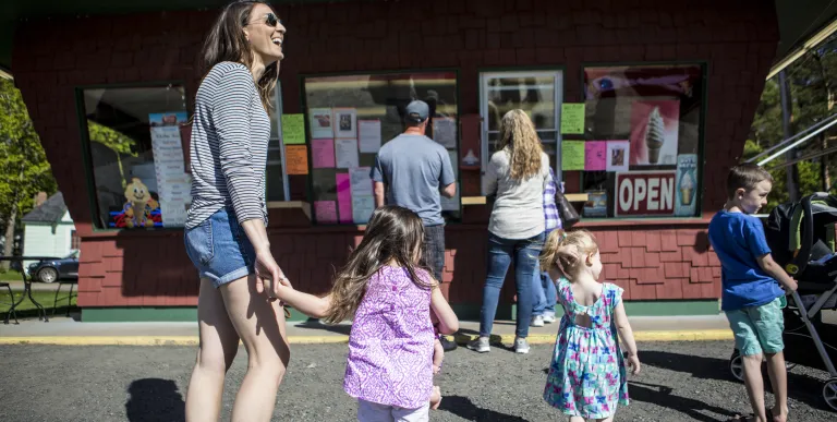 A family stands in line to get ice crea