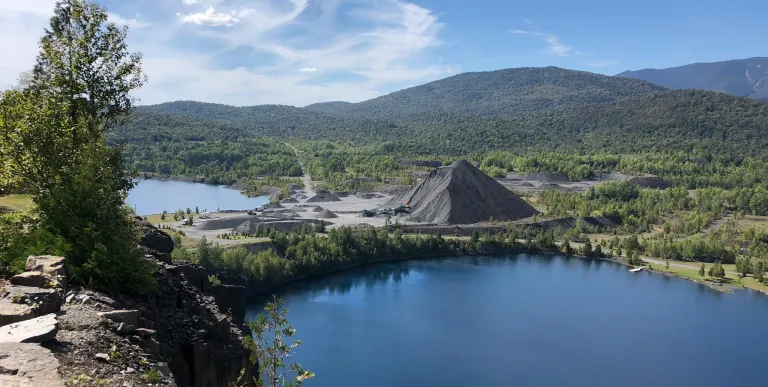 Blue skies over a body of water.