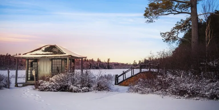 Looking through the window at white whicker furniture