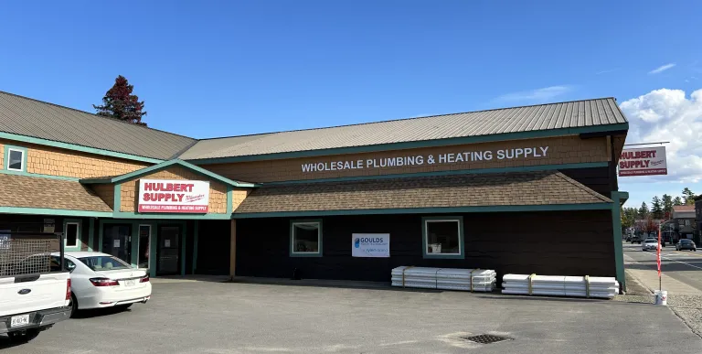 A brown building with shake roof.
