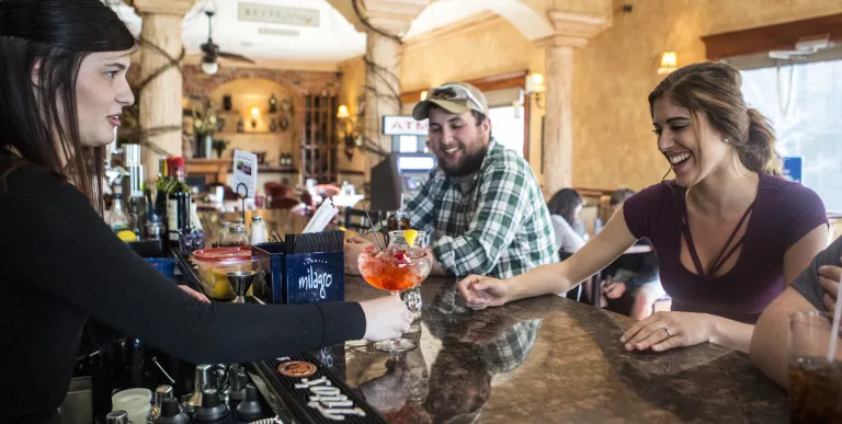 Happy people at the bar