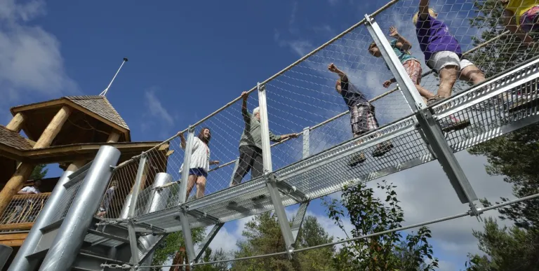 A family explores a foggy exhibit at Tupper Lake's Wild Center