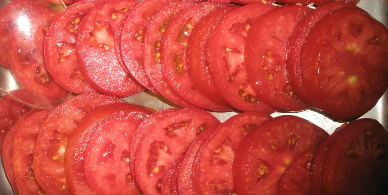 Perfectly ripe red sliced tomatoes.