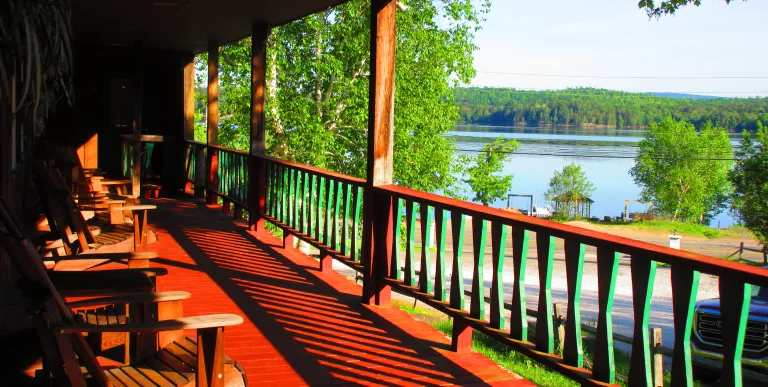 A large covered porch overlooking the lake