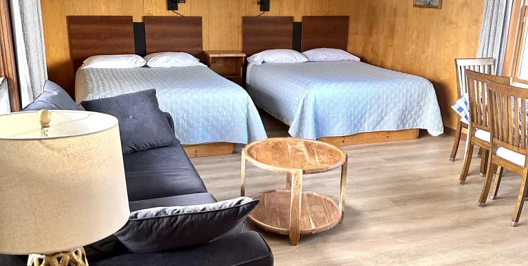 A two queen room with lamp