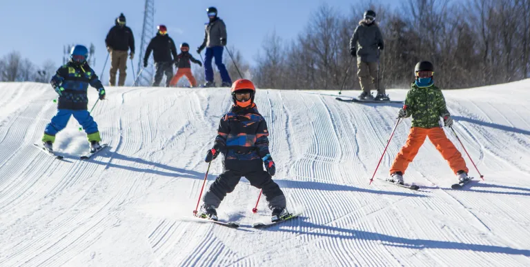 A few downhill skiers on Mt Pisgah
