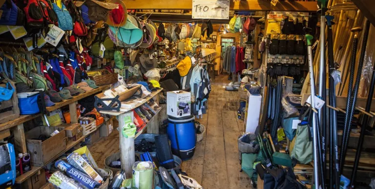 Shelves packed with colorful adventure gear.