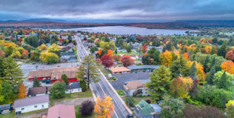 View of the lake and the road through Tupper Lake in the fall.