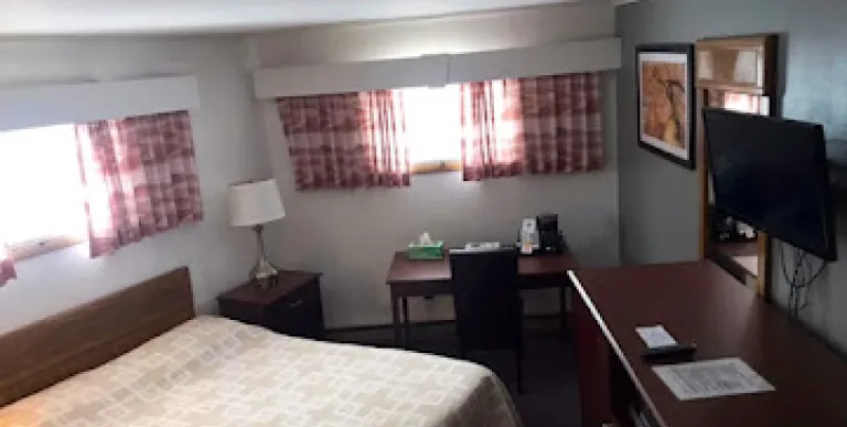 A high angle view of a room with desk and multiple windows.