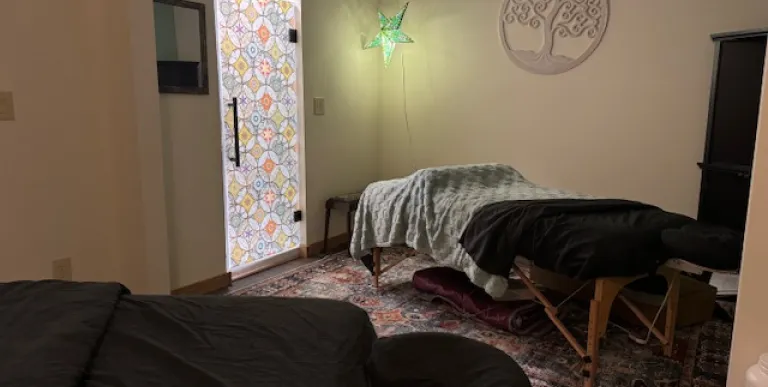 A treatment room with two beds for couples massages.