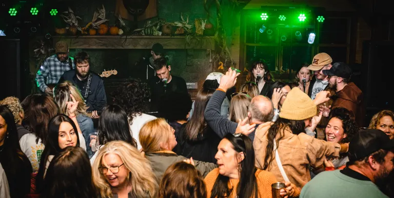A dance party ensues from the live music.