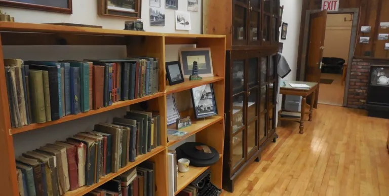 Shelves of books and displays on the wall.