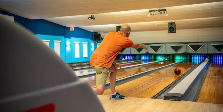 A man bowls.