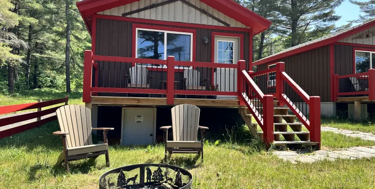 Exterior of cabin with Red trim and brown siding