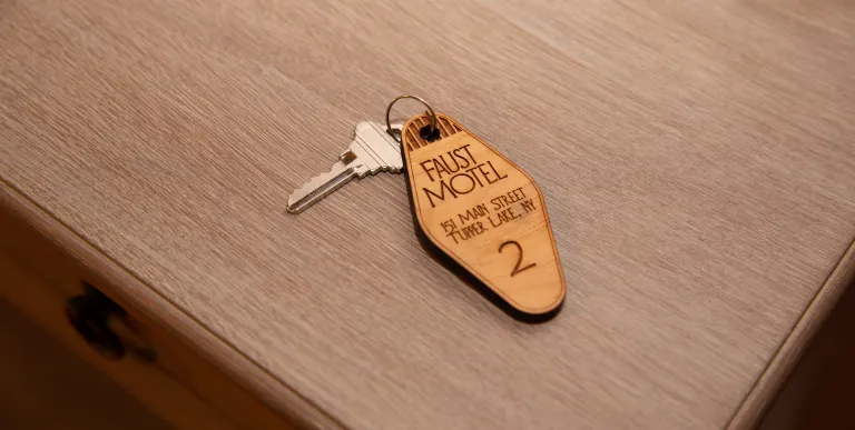 A key on a charm for room 2 at The Faust Motel.