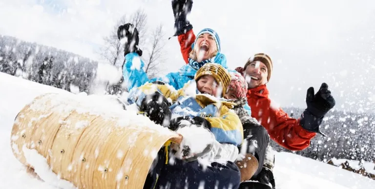 A happy family on a toboggan